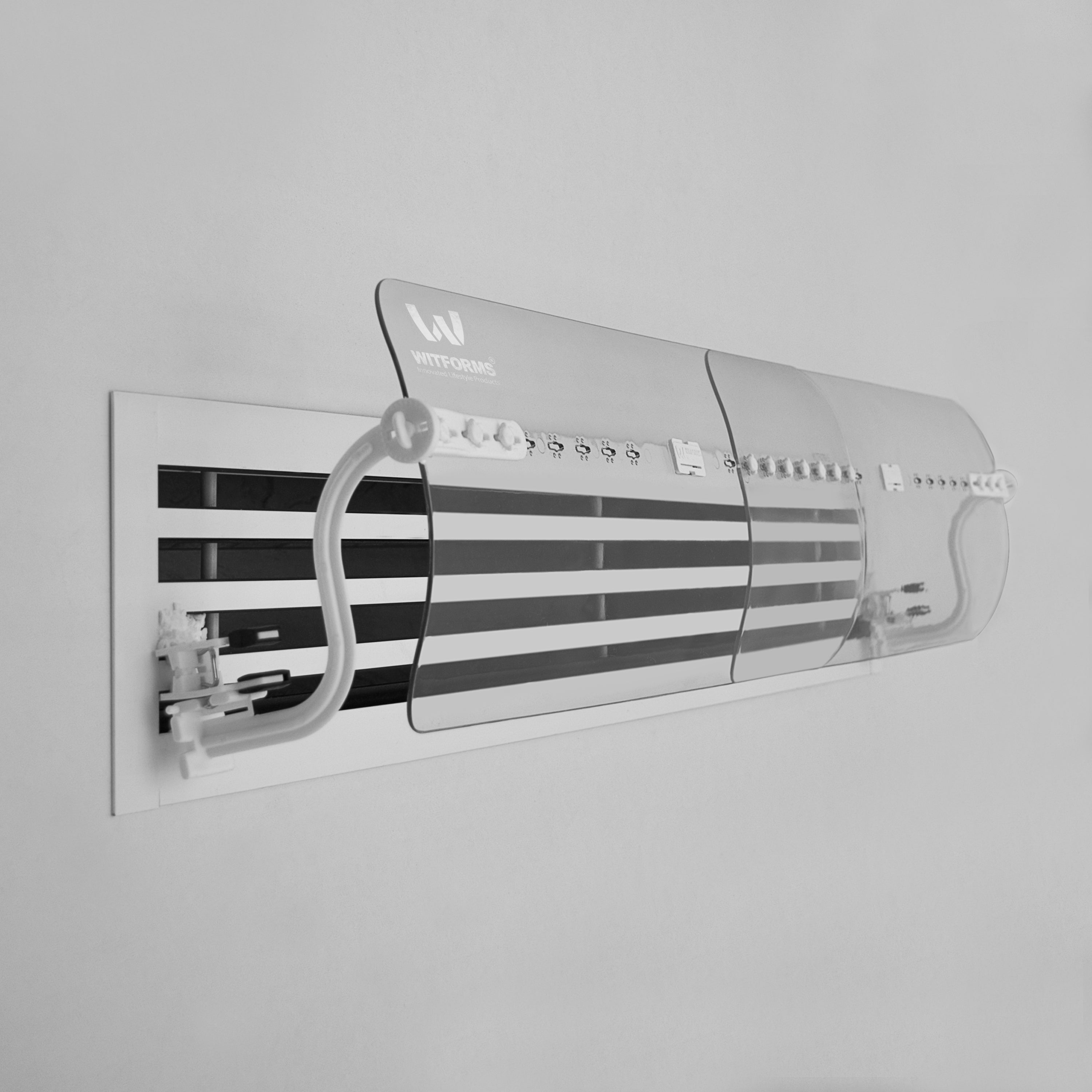 Wall-mounted air conditioning unit with a clear cover on a gray background